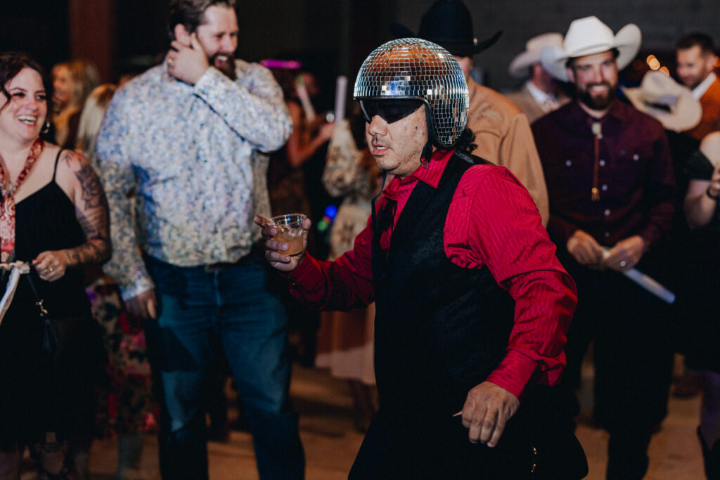 Guests dancing during western Arizona ranch wedding reception”